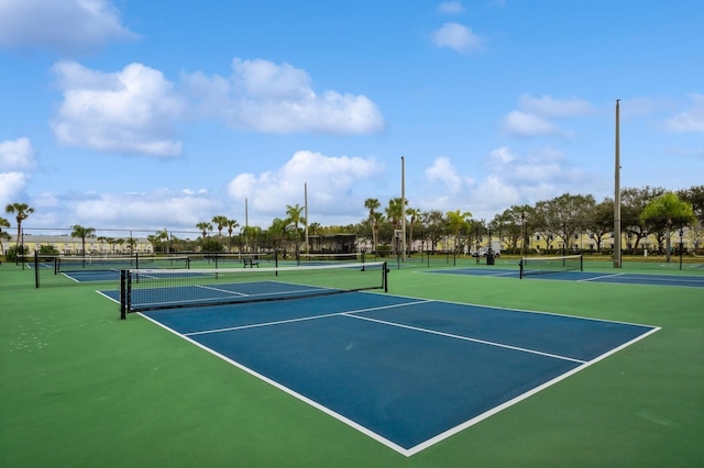 view of tennis court with fence