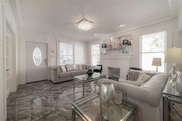 living room featuring ornamental molding, marble finish floor, and a fireplace