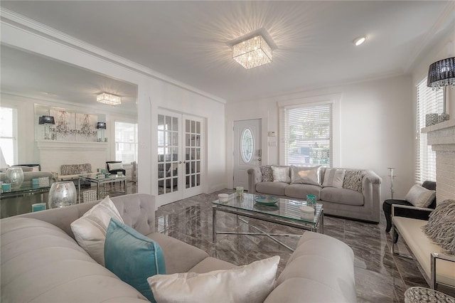 living room featuring ornamental molding, marble finish floor, french doors, and a brick fireplace