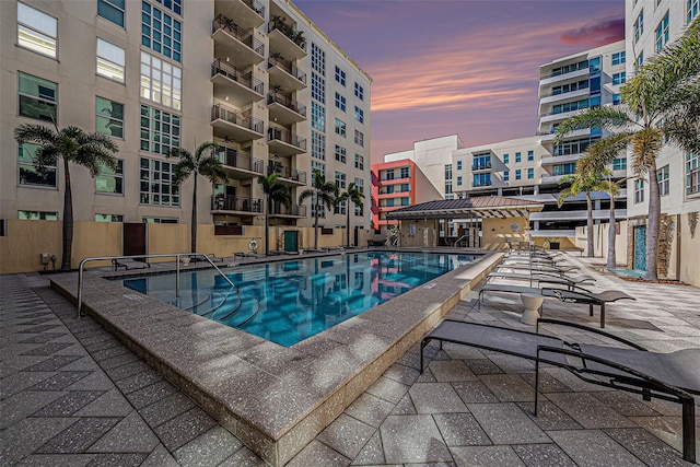 view of pool at dusk