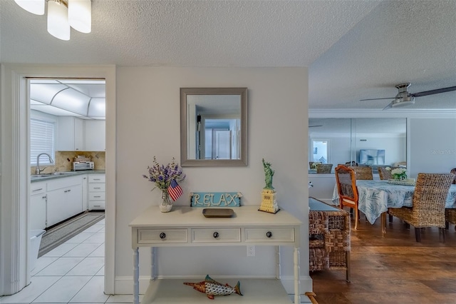 131 Bluff View Dr Unit 208, Belleair Bluffs, FL 33770 - corridor with a sink and a textured ceiling