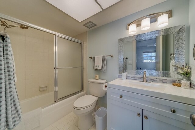131 Bluff View Dr Unit 208, Belleair Bluffs, FL 33770 - bathroom with enclosed tub / shower combo, vanity, and tile patterned flooring