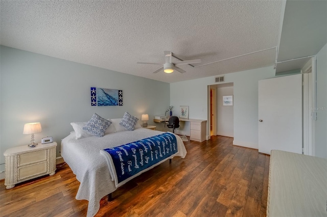 131 Bluff View Dr Unit 208, Belleair Bluffs, FL 33770 - bedroom featuring wood finished floors, a textured ceiling, and a ceiling fan