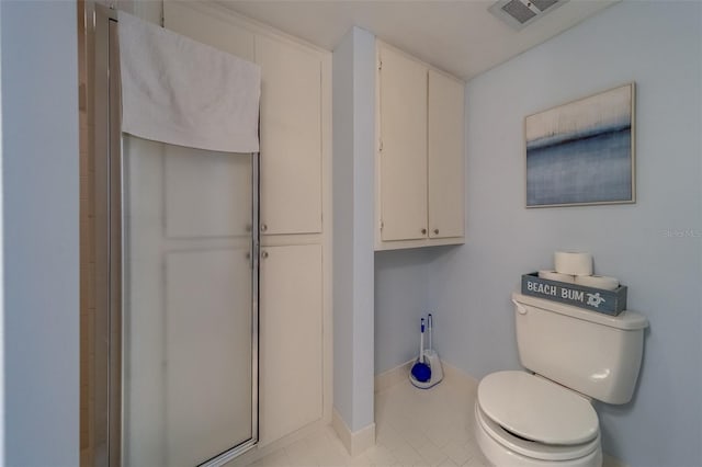 131 Bluff View Dr Unit 208, Belleair Bluffs, FL 33770 - bathroom with toilet and tile patterned flooring