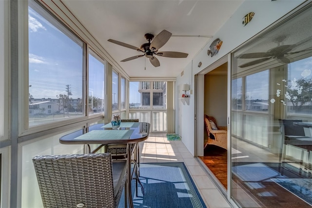 131 Bluff View Dr Unit 208, Belleair Bluffs, FL 33770 - sunroom / solarium featuring a ceiling fan and tile patterned flooring