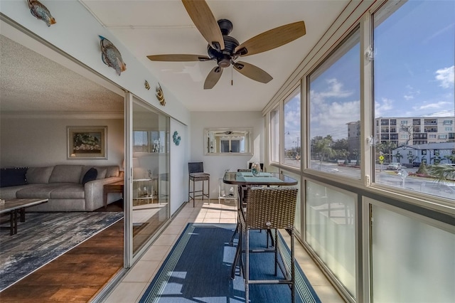 131 Bluff View Dr Unit 208, Belleair Bluffs, FL 33770 - sunroom featuring tile patterned flooring