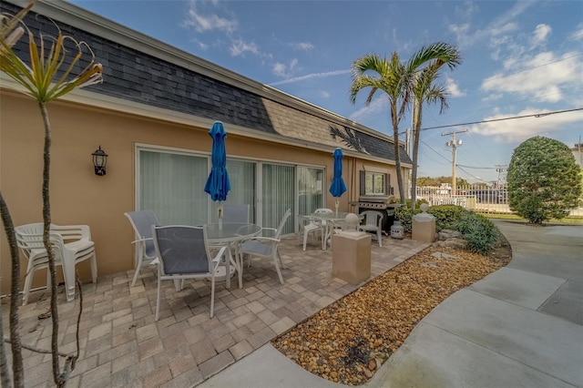 131 Bluff View Dr Unit 208, Belleair Bluffs, FL 33770 - view of patio / terrace featuring outdoor dining space and grilling area