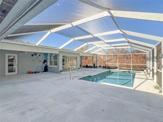 outdoor pool featuring a lanai, a patio, and ceiling fan