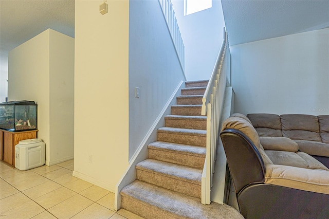 stairs with tile patterned floors