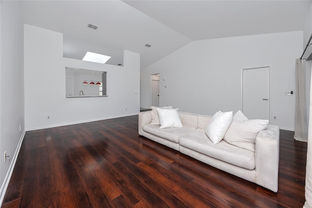 unfurnished living room with lofted ceiling, dark wood finished floors, visible vents, and baseboards