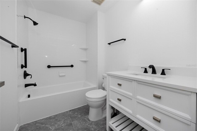 bathroom with shower / washtub combination, vanity, and toilet