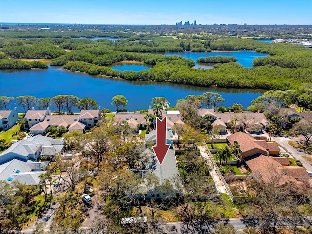 birds eye view of property with a water view and a residential view