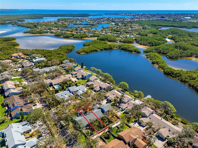 drone / aerial view featuring a residential view and a water view