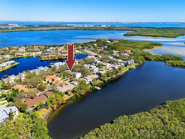 drone / aerial view with a water view and a residential view