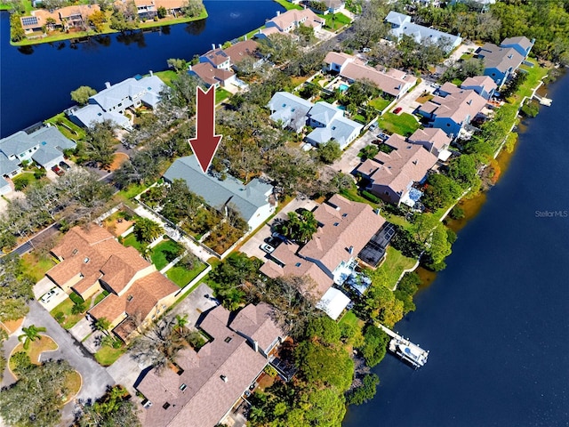 aerial view with a residential view and a water view