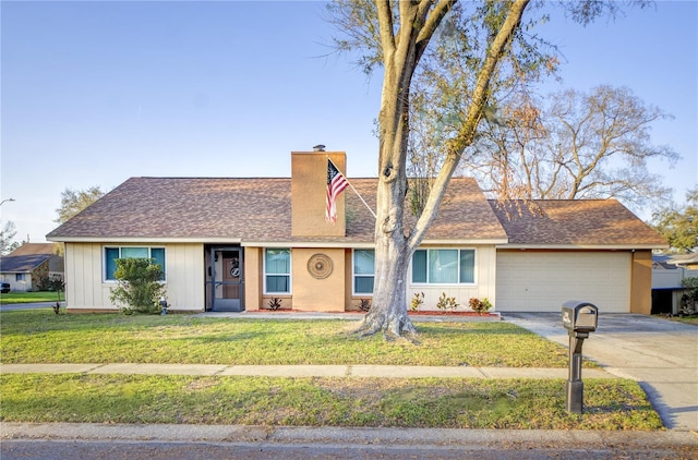 ranch-style house with a garage, a shingled roof, concrete driveway, a chimney, and a front lawn