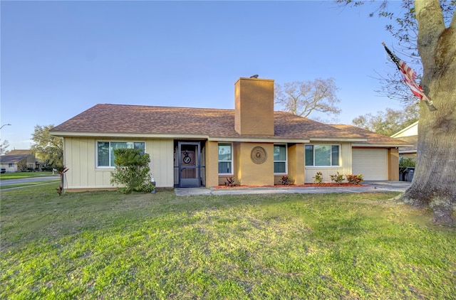 ranch-style home featuring a garage, a shingled roof, a chimney, board and batten siding, and a front yard