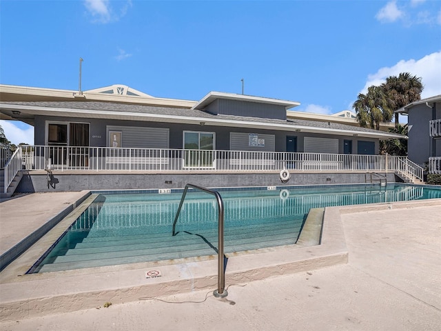 pool with a patio