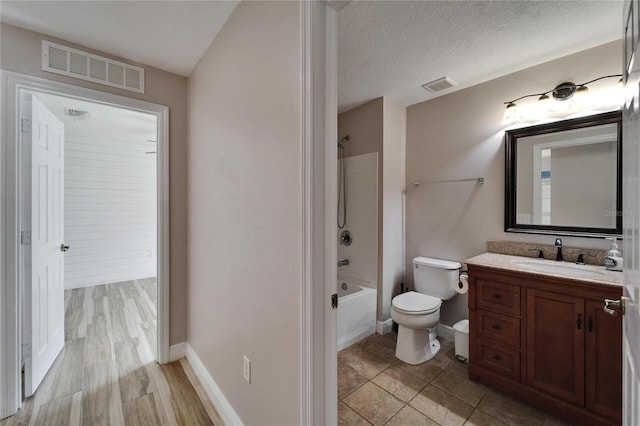 full bathroom with  shower combination, visible vents, toilet, and vanity