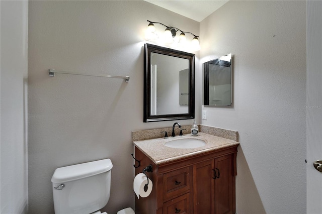 bathroom with toilet and vanity