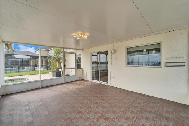 unfurnished sunroom with a healthy amount of sunlight