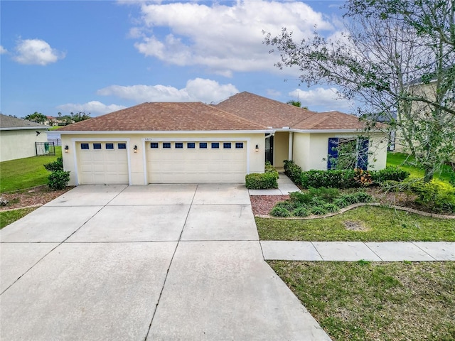 ranch-style house featuring stucco siding, a shingled roof, concrete driveway, a front yard, and a garage