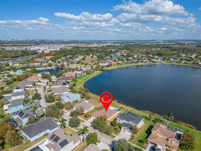 birds eye view of property with a water view and a residential view