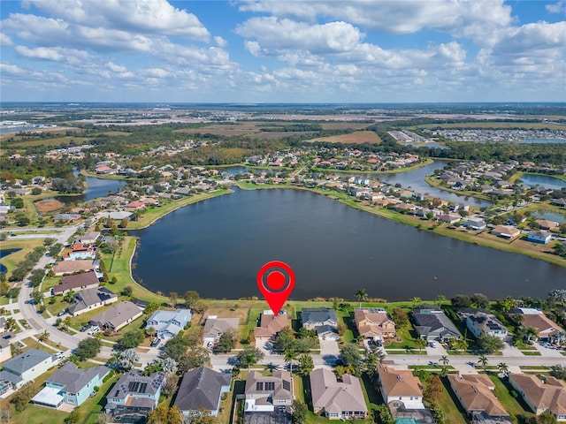 birds eye view of property featuring a water view and a residential view