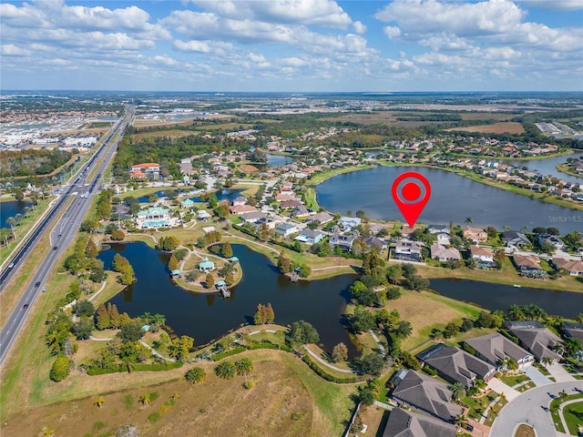 birds eye view of property featuring a water view and a residential view