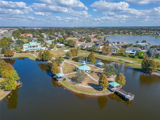 drone / aerial view featuring a water view and a residential view