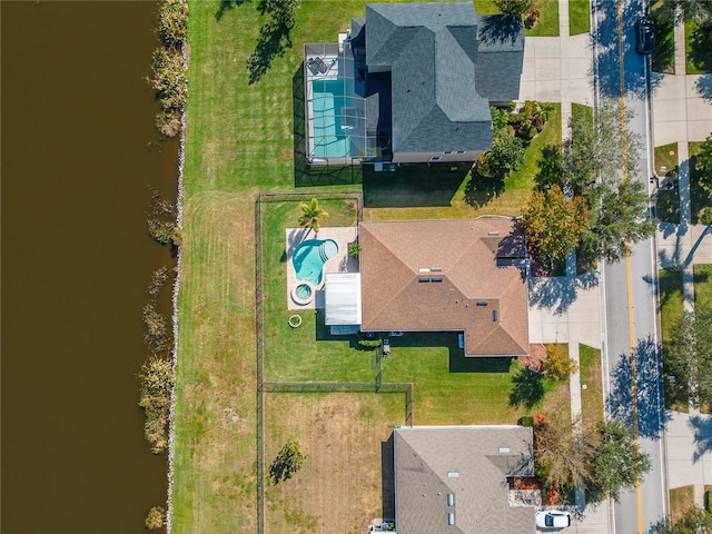 birds eye view of property featuring a water view