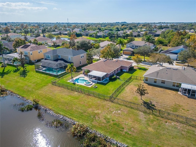 bird's eye view with a water view and a residential view