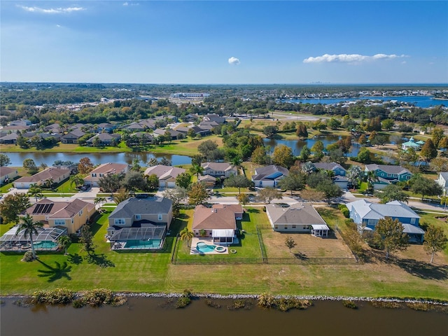 aerial view with a residential view and a water view