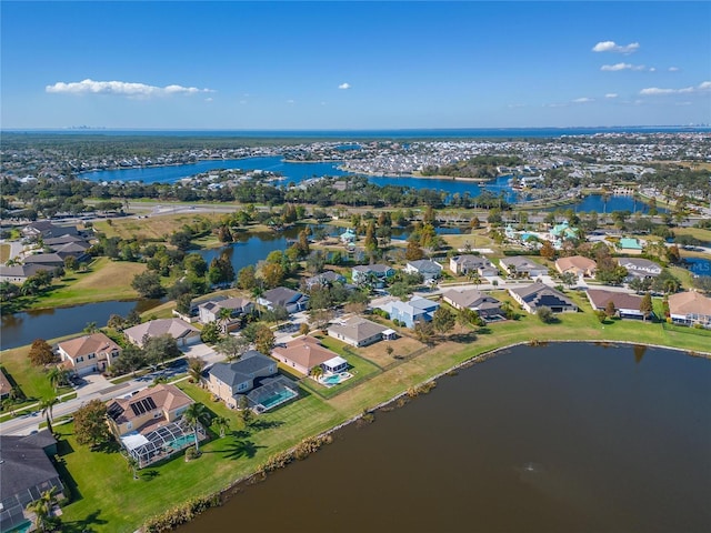 bird's eye view with a water view and a residential view