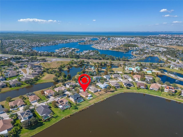 birds eye view of property with a residential view and a water view