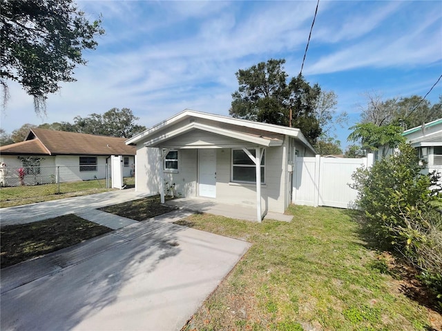 bungalow-style home featuring a front yard