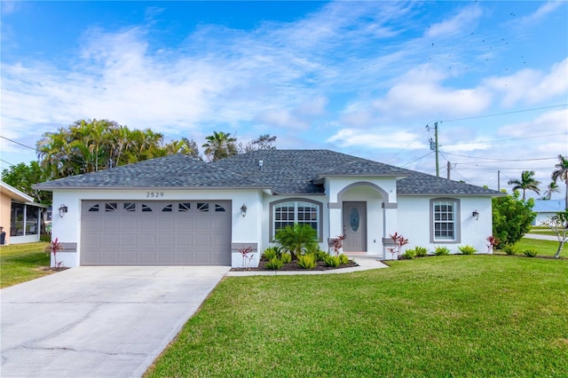 single story home with a front lawn and a garage