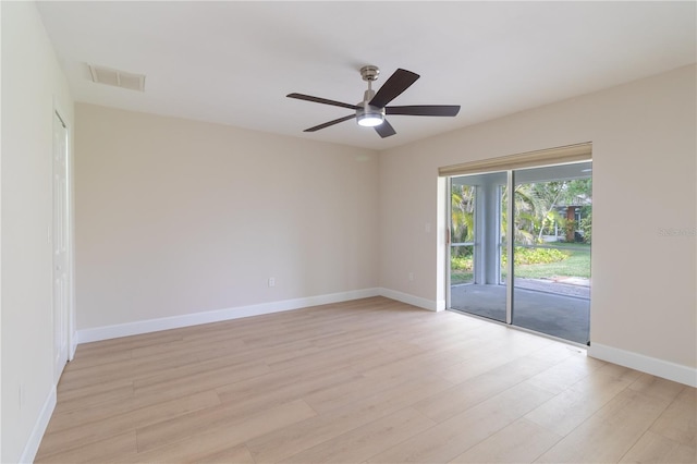 spare room with light hardwood / wood-style floors and ceiling fan