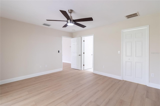 unfurnished bedroom with light wood-type flooring and ceiling fan