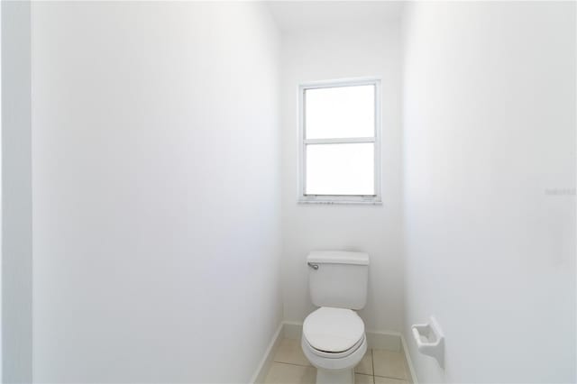 bathroom featuring tile patterned floors and toilet