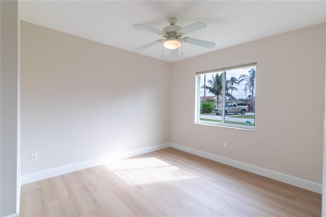 unfurnished room with light hardwood / wood-style flooring and ceiling fan