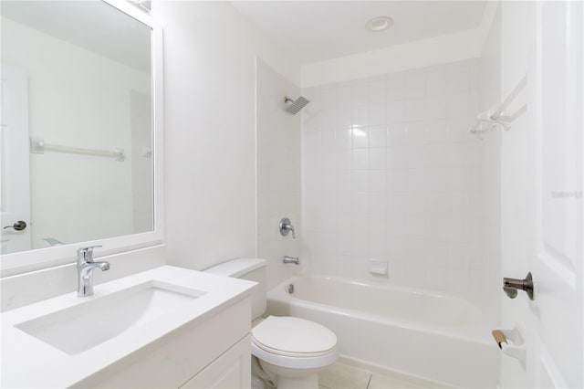 full bathroom with tile patterned floors, toilet, vanity, and tiled shower / bath combo