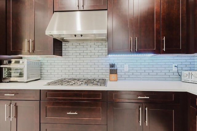 kitchen featuring stainless steel gas cooktop and backsplash