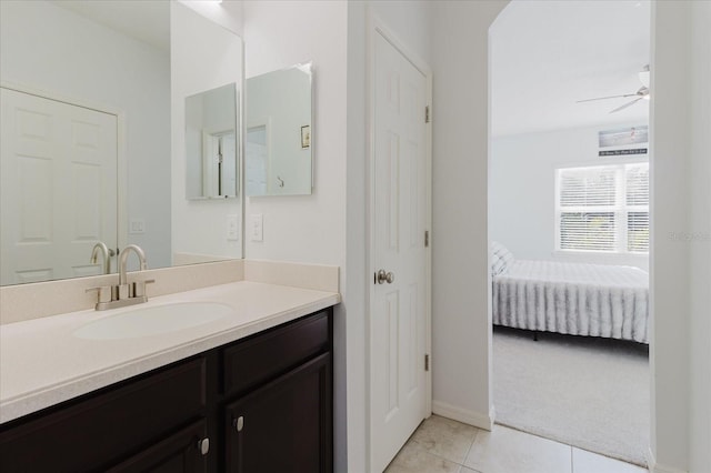 bathroom with ceiling fan, vanity, and tile patterned floors