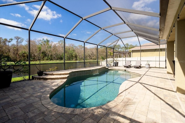 view of pool featuring a patio area and a lanai