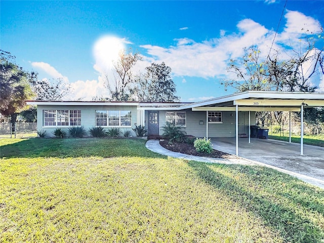 ranch-style house with a carport and a front yard