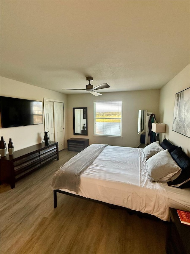 bedroom featuring ceiling fan and wood finished floors