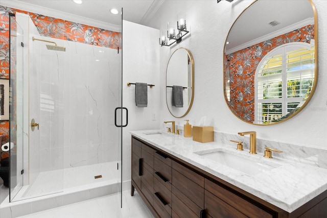 bathroom with double vanity, ornamental molding, a stall shower, and a sink