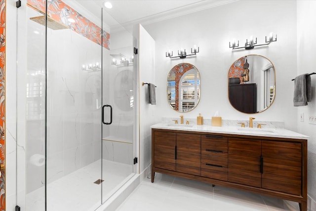 bathroom featuring double vanity, a stall shower, crown molding, and a sink