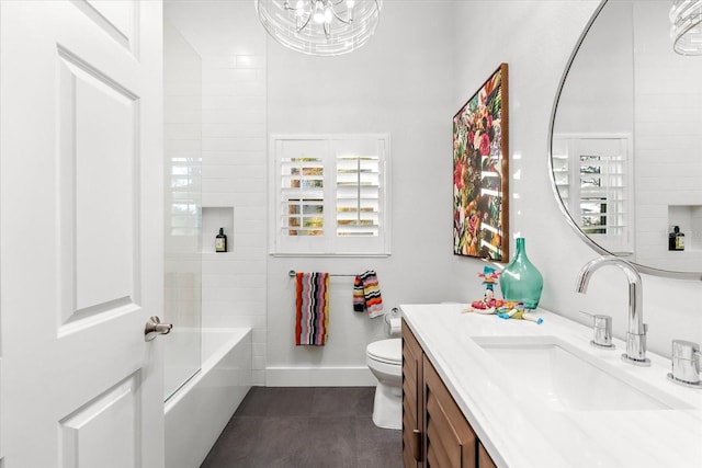 bathroom with tile patterned floors, toilet, an inviting chandelier, baseboards, and vanity